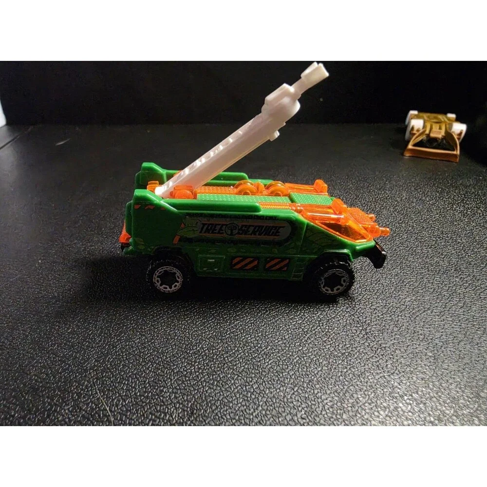 Lot of 4 loose Hot Wheels vehicles in pre-owned condition.